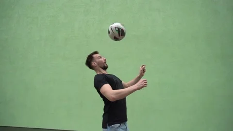 Soccer player plays with the ball. Doing football tricks. Outdoor. Slow motion Stock Footage 90848465