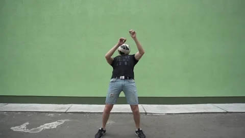 Soccer player plays with the ball. Doing football tricks. Outdoor. Slow motion Stock Footage 90851249