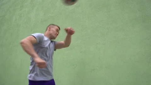 Soccer player plays with the ball. Doing football tricks. Outdoor. Slow motion Stock Footage 90854597