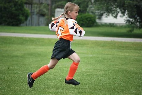 Soccer player running Stock Photos