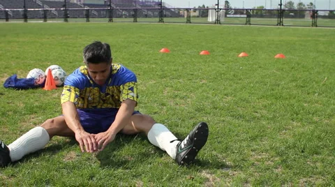 Soccer player stretching Stock Footage 6115192