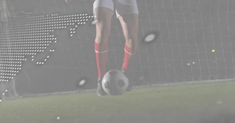 Soccer player tapping ball by net, map and code overlay fading in analyzing ball Stock Footage 318740663