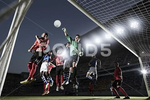 Soccer players defending goal Stock Photos
