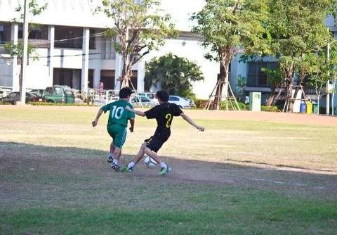 Soccer players fighting for the ball 스톡 사진