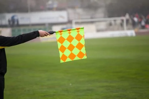 Soccer referee hold the flag. Offside trap Stock-Fotos