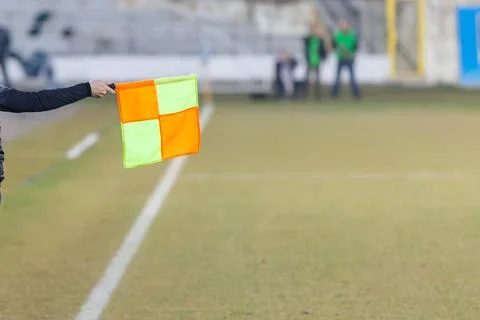Soccer referee hold the flag. Offside trap Stock Photos