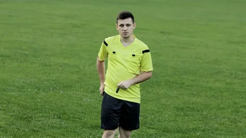 Soccer referee showing red card and removes player Stock Footage 159699870