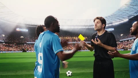 Soccer referee showing yellow card to angry player protesting during match Stock Footage 337995040