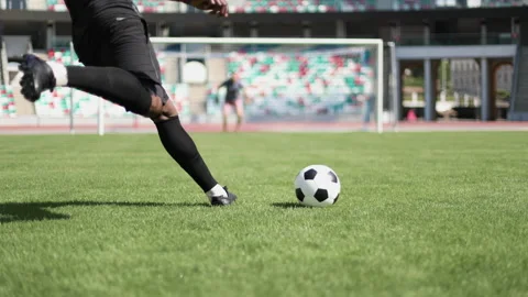 Soccer striker ready to kicks the ball in the football goal Stock Footage 239402411
