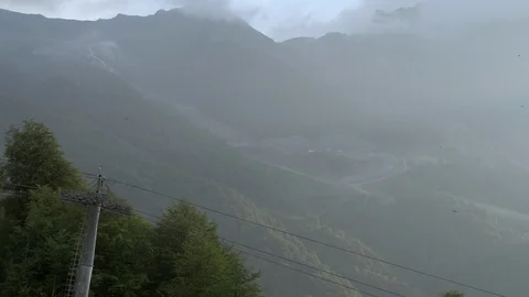 Sochi, Roza Khutor in summer time. funicular or cable-railway in mountains. 4k Stock Footage 97721819