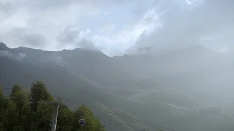 Sochi, Roza Khutor in summer time. funicular or cable-railway in mountains. 4k Stock Footage 97723632