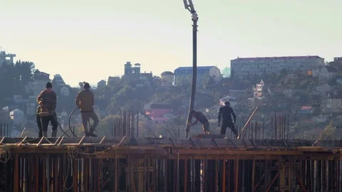 SOCHI, RUSSIA Workers build a frame house and pour concrete. Stockbeeldmateriaal 70499825