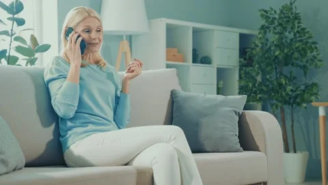 Sociable friendly lady sit sofa enjoy weekend conversation laugh rejoice Stock Footage 166904600