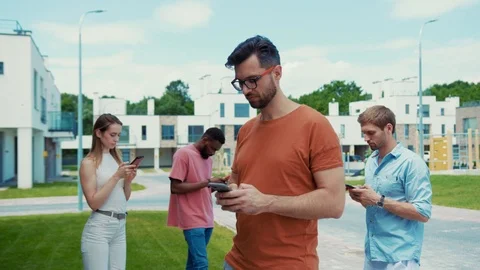 Sociable young nation. Mobile technology and people. Young handsome man and his Stock Footage 113796469