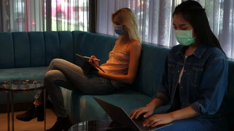 Social distancing concept Beautiful foreigner woman woking on tablet compute Stock Footage 137449845