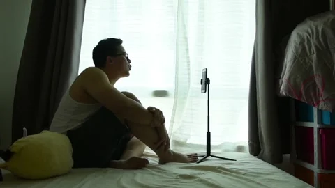 Social distancing concept by man use vdo call happy talking with girlfriend Stock Footage 132052182