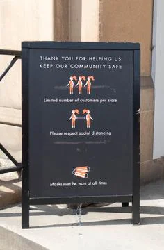Social Distancing information board outside Sweaty Betty Shop Stock Photos