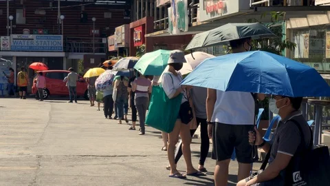 Social distancing queue outside grocery store due to COVID 19 Stock Footage 128561394