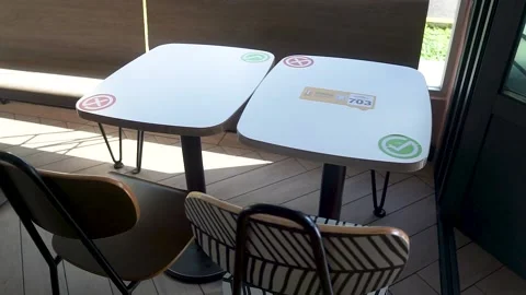 Social distancing sticker on restaurant table. Stock Footage 167533016