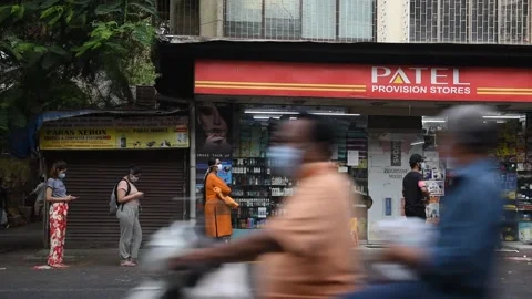 Social distancing-waiting-queue-general store-Lockdown Due To Coronavirus COVID Stock Footage 130998603