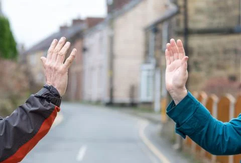 Social distancing wave, greeting to avoid spread of coronavirus Foto stock