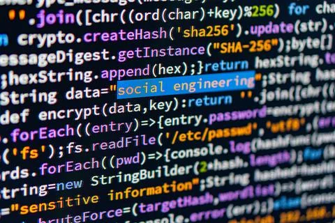 Social engineering. Image shows a close-up of C code highlighting social en.. Foto stock