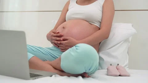Social for every thing every time concept.Pregnant woman taking a video confe Stock Footage 164670636