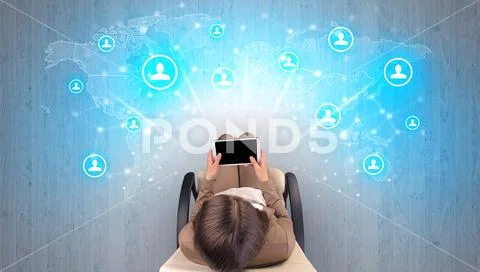 Social media concept with women sitting on chair Stock Photos