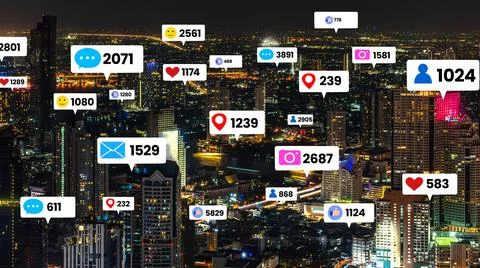 Social media icons fly over city downtown showing people engagement connection Stock Photos