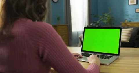 Social media manager using tablet to curate content, schedule posts, engage with Stock Footage 275302090