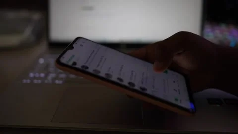 Social media profile scroll down smartphone by hand Stock Footage 290949497