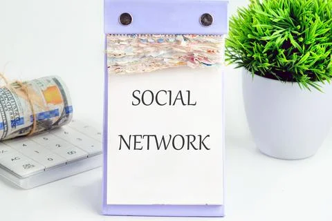 A social network concept is presented alongside financial tools and greenery, Stock Photos