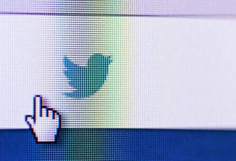 Social network twitter icon on computer screen Stock Photos