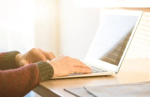 Social network user man working from home using notebook computer, selective  Stock Photos