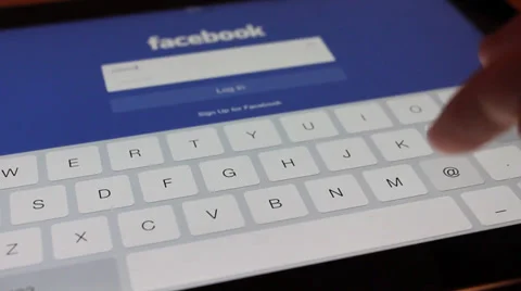 Social networking on iPad with facebook Stock Footage 33729759