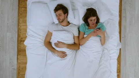 Social problem. Angry girlfriend reading texting of her boyfriend, beating him. Stock Footage 85664396