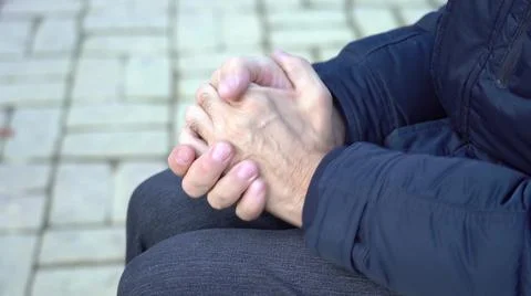 Social problems concept. Hands of a pensioner close up. Financial difficulties. Stock Photos