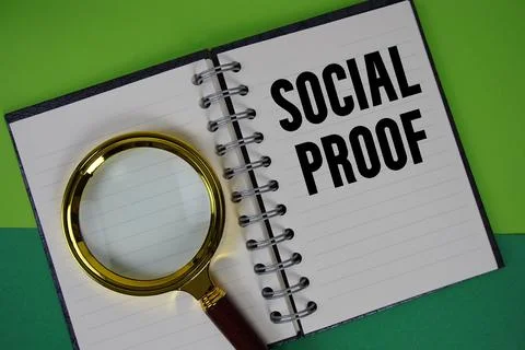 Social Proof text written on notebook paper with magnifying glass Stock Photos
