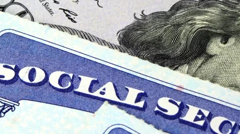 Social security card and US currency one hundred dollar bill Stock Footage