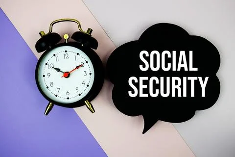 Social Security text on speech bubble with alarm clock top view on purple g.. Stock Photos