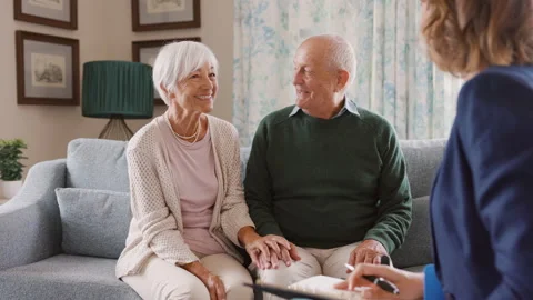 Social worker visiting senior couple at home Stock Footage 157150652