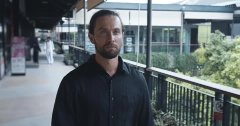 Socialization concept. Man walks in motion shopping center to visit exhibitions Stock Footage 256914894