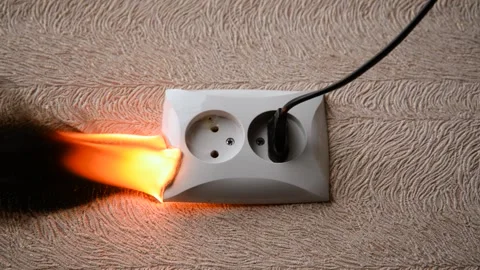 The socket and plug of the electric wire light up. Stock Footage 142985600