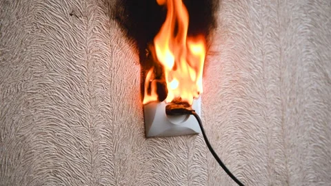 The socket and plug of the electric wire light up. Stock Footage 143328786