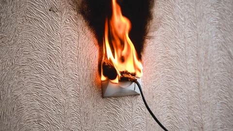 The socket and plug of the electric wire light up. Stock Footage 144980579