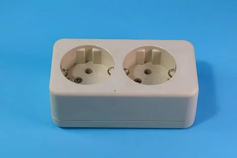 Socket and plug isolated on blue Stock Photos