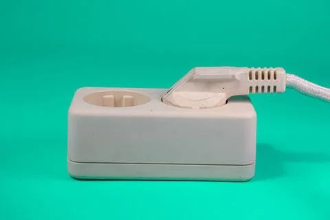 Socket and plug isolated on green Stock Photos