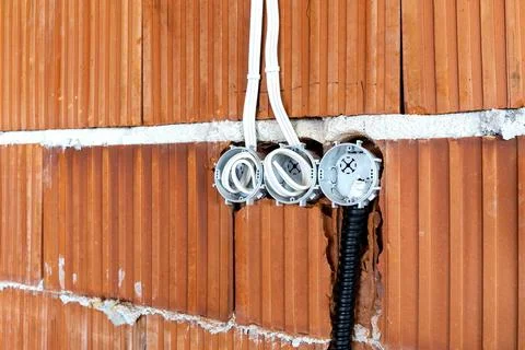 Socket back boxes with wires in a wall Stock Photos
