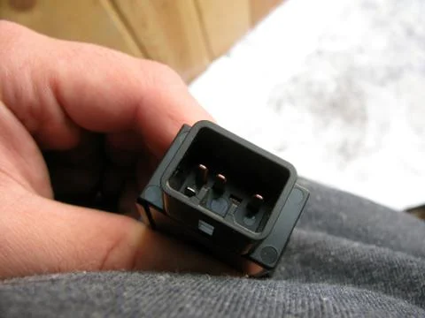 Socket button car in the hands of Stock Photos