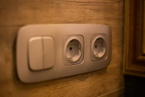 Socket for electrical appliances in a modern apartment inside the house Stock Photos